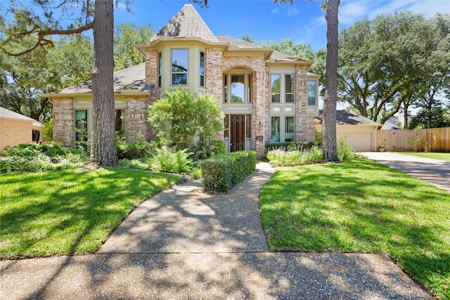 22015 Fielder Dr, Katy, TX 77450 - view of front of property featuring driveway, brick siding, a garage, and a shingled roof