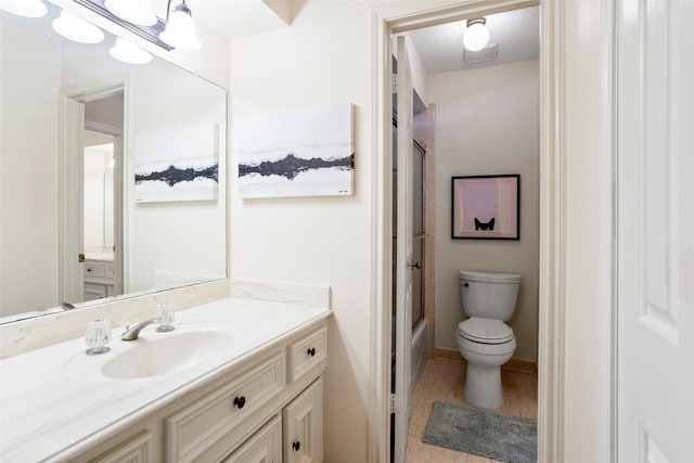 22015 Fielder Dr, Katy, TX 77450 - full bathroom with toilet, vanity, bath / shower combo with glass door, baseboards, and tile patterned flooring