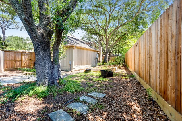 22015 Fielder Dr, Katy, TX 77450 - fenced backyard featuring a garden