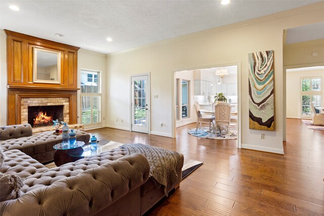 22015 Fielder Dr, Katy, TX 77450 - living area featuring crown molding, recessed lighting, baseboards, wood-type flooring, and a textured ceiling