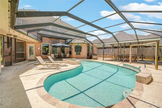 218 Moss Rose Ln, Lake Jackson, TX 77566 - view of swimming pool with a patio area, fence, glass enclosure, and a pool with connected hot tub