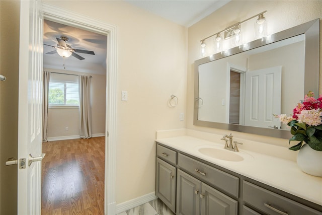 218 Moss Rose Ln, Lake Jackson, TX 77566 - bathroom featuring vanity, ceiling fan, wood finished floors, and baseboards