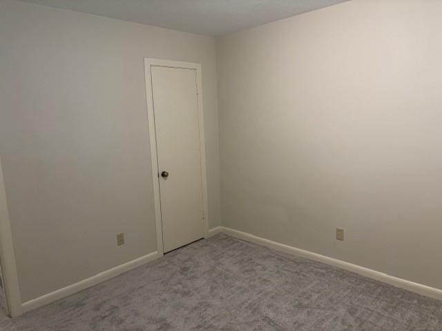 5542 Holly St Unit 206, Houston, TX 77081 - unfurnished room featuring carpet and baseboards