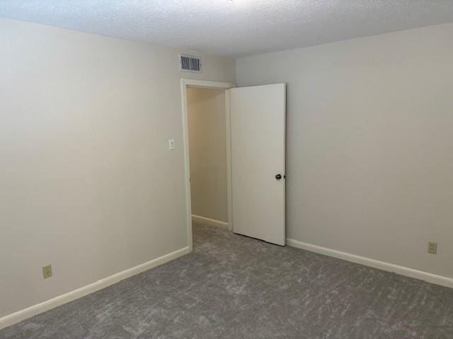 5542 Holly St Unit 206, Houston, TX 77081 - carpeted spare room featuring a textured ceiling and baseboards