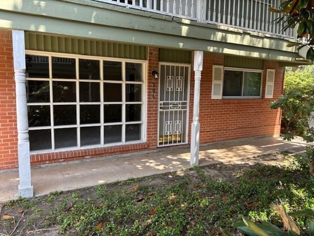 5542 Holly St Unit 206, Houston, TX 77081 - entrance to property featuring brick siding and covered porch