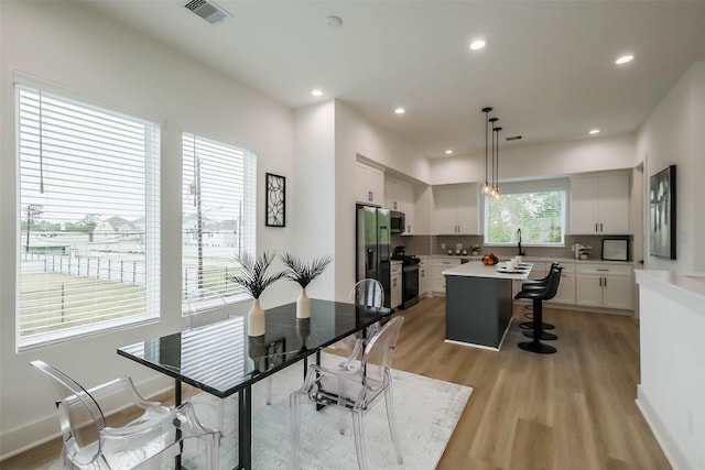 5703 Balbo St Unit B, Houston, TX 77091 - dining room with light wood-style flooring and recessed lighting