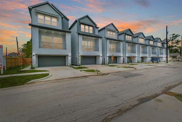 5703 Balbo St Unit B, Houston, TX 77091 - multi unit property with an attached garage, fence, driveway, a residential view, and board and batten siding