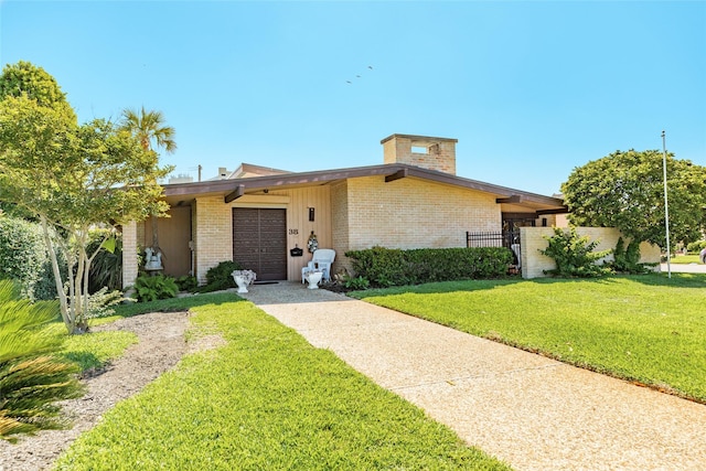 38 Adler Cir, Galveston, TX 77551 - mid-century home featuring brick siding