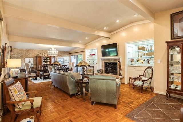38 Adler Cir, Galveston, TX 77551 - living room with a brick fireplace, a chandelier, brick wall, baseboards, and recessed lighting