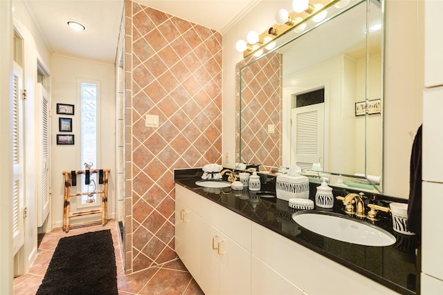 38 Adler Cir, Galveston, TX 77551 - bathroom featuring ornamental molding, tile patterned floors, double vanity, and a closet