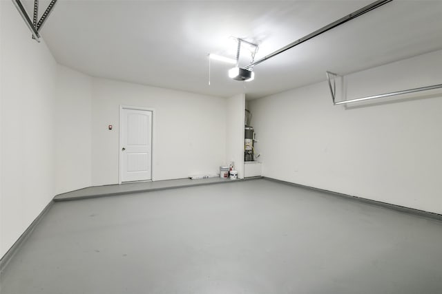 211 Rd 66111, Dayton, TX 77535 - garage featuring a garage door opener and secured water heater