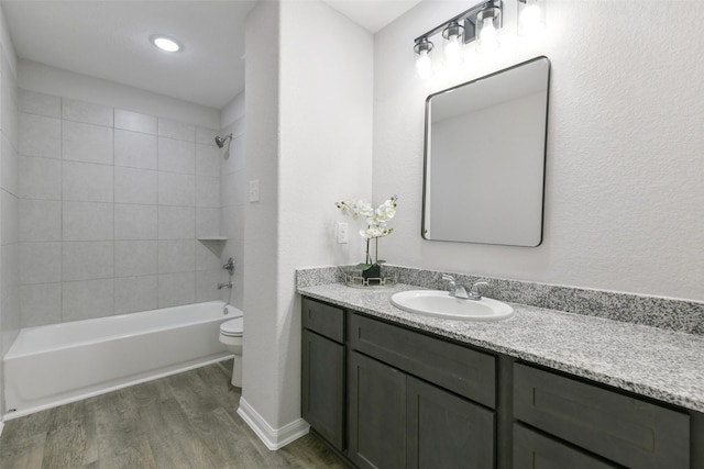 211 Rd 66111, Dayton, TX 77535 - bathroom with toilet, wood finished floors, vanity, and bathtub / shower combination