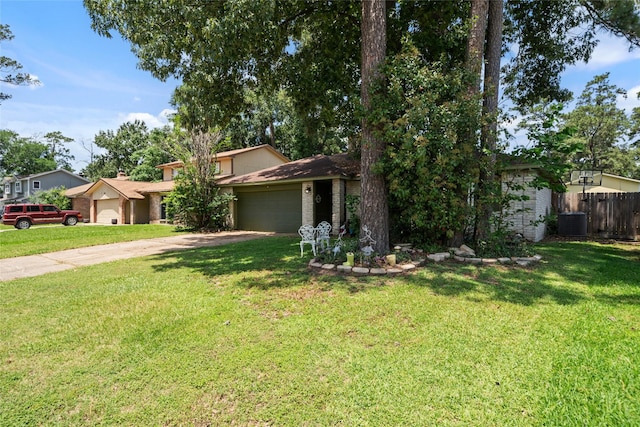 4931 Glendower Dr, Spring, TX 77373 - view of front of home featuring a garage, concrete driveway, central air condition unit, and brick siding