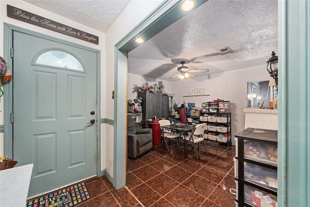 4931 Glendower Dr, Spring, TX 77373 - foyer featuring a textured ceiling and a ceiling fan