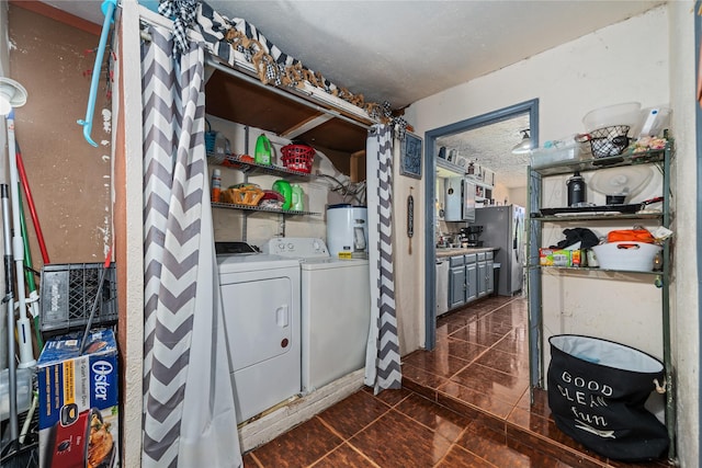 4931 Glendower Dr, Spring, TX 77373 - clothes washing area featuring water heater, washing machine and clothes dryer, and dark tile patterned floors