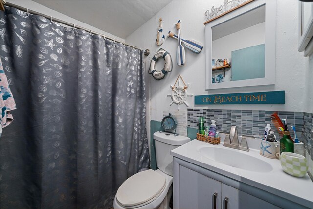 4931 Glendower Dr, Spring, TX 77373 - full bath featuring toilet, tasteful backsplash, vanity, and a shower with curtain