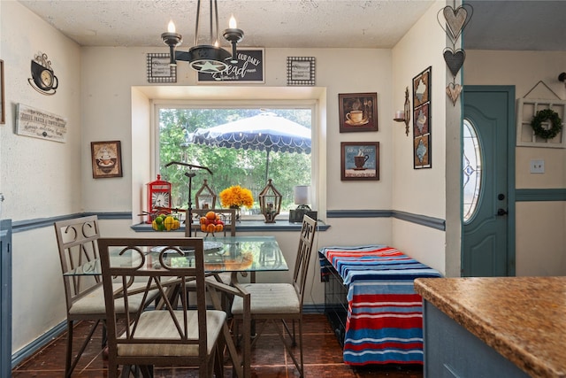 4931 Glendower Dr, Spring, TX 77373 - dining area with a textured ceiling, a chandelier, and baseboards