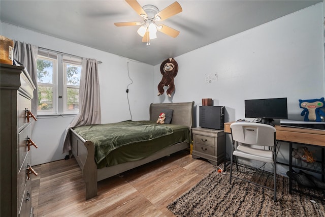 4931 Glendower Dr, Spring, TX 77373 - bedroom with light wood-style floors, a ceiling fan, and a desk