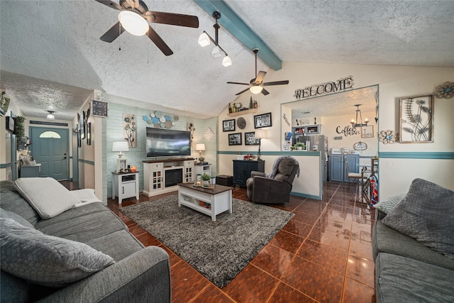 4931 Glendower Dr, Spring, TX 77373 - living area featuring a textured ceiling, ceiling fan, and baseboards