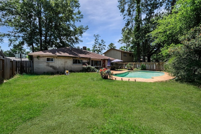 4931 Glendower Dr, Spring, TX 77373 - rear view of house with brick siding and a chimney
