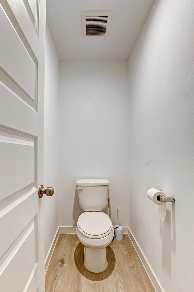31611 Farlam Farms Trl, Fulshear, TX 77441 - bathroom with wood finished floors, toilet, and baseboards