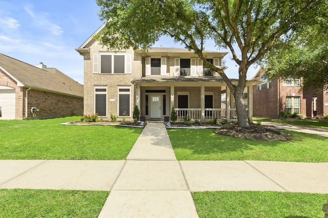 4914 Fern Cove Dr, Baytown, TX 77521 - traditional-style home featuring a porch, brick siding, and a front lawn
