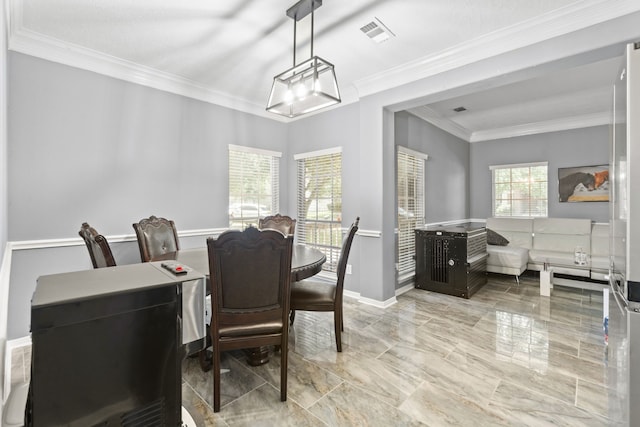 4914 Fern Cove Dr, Baytown, TX 77521 - dining area featuring ornamental molding, baseboards, and marble finish flooring
