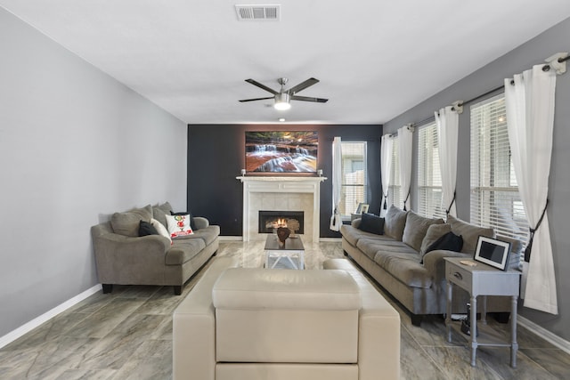 4914 Fern Cove Dr, Baytown, TX 77521 - living room with baseboards, ceiling fan, and a tiled fireplace