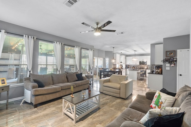 4914 Fern Cove Dr, Baytown, TX 77521 - living area with ceiling fan and baseboards