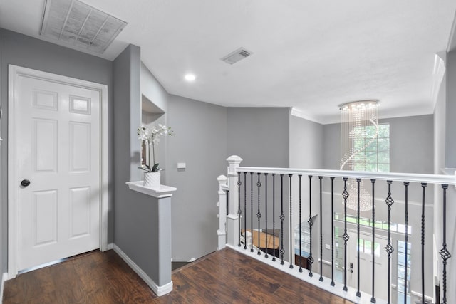 4914 Fern Cove Dr, Baytown, TX 77521 - hallway with wood finished floors, an upstairs landing, a chandelier, and baseboards