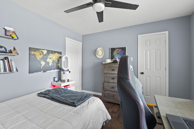4914 Fern Cove Dr, Baytown, TX 77521 - bedroom with dark wood finished floors, a desk, and ceiling fan