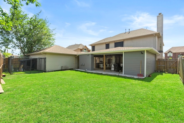 4914 Fern Cove Dr, Baytown, TX 77521 - rear view of house with a chimney and a patio area