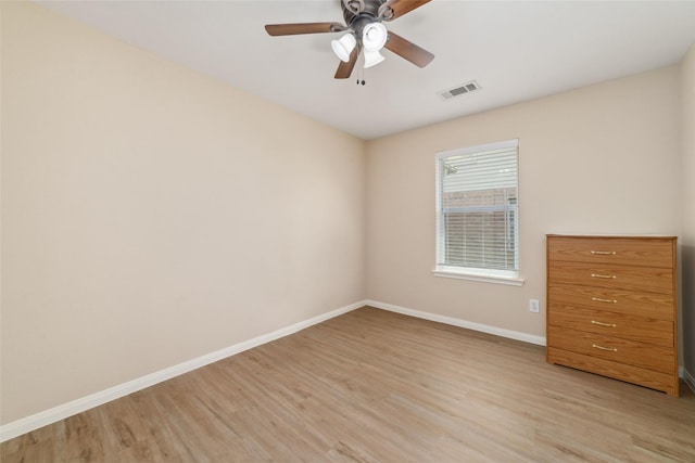 8123 Solara Bnd, Houston, TX 77083 - unfurnished bedroom featuring baseboards, light wood-style floors, and ceiling fan