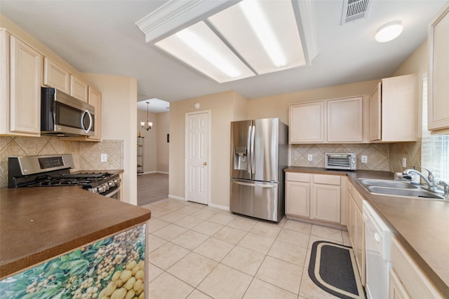 8123 Solara Bnd, Houston, TX 77083 - kitchen with appliances with stainless steel finishes, a sink, backsplash, baseboards, and dark countertops