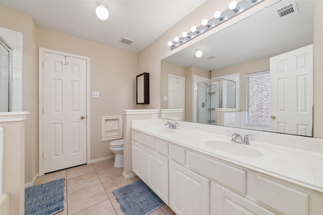 8123 Solara Bnd, Houston, TX 77083 - bathroom with a stall shower, tile patterned floors, toilet, double vanity, and baseboards