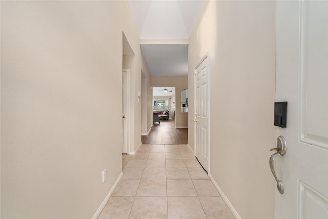 8123 Solara Bnd, Houston, TX 77083 - hall with light tile patterned floors and baseboards