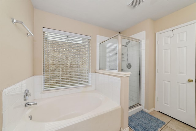8123 Solara Bnd, Houston, TX 77083 - full bathroom with a shower stall, a garden tub, and tile patterned floors