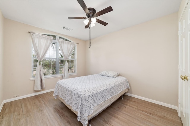 8123 Solara Bnd, Houston, TX 77083 - bedroom with baseboards, light wood-style floors, and ceiling fan