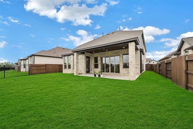 510 Rita Blanca Dr, Webster, TX 77598 - back of property with a patio, brick siding, and roof with shingles