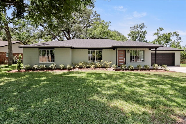 240 Sleepy Hollow Dr, Lake Jackson, TX 77566 - view of front of house with an attached garage, a front lawn, driveway, and roof with shingles