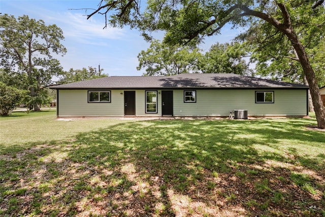 240 Sleepy Hollow Dr, Lake Jackson, TX 77566 - view of front of house with a front yard and central AC unit