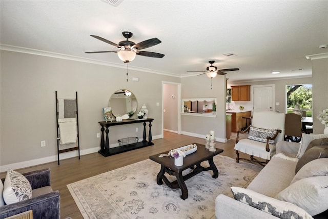 240 Sleepy Hollow Dr, Lake Jackson, TX 77566 - living room with a ceiling fan, light wood finished floors, crown molding, and baseboards