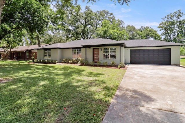 240 Sleepy Hollow Dr, Lake Jackson, TX 77566 - single story home with an attached garage, driveway, a front yard, and stucco siding