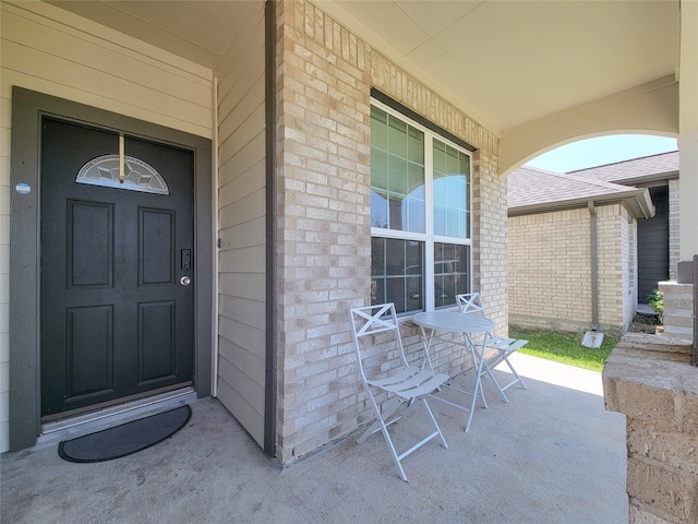 3430 Hughes Meadow Way, Richmond, TX 77406 - view of exterior entry featuring a porch and brick siding