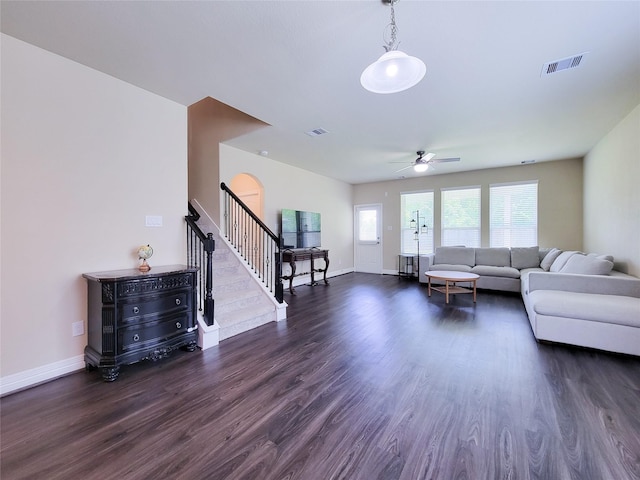 3430 Hughes Meadow Way, Richmond, TX 77406 - living room with stairs, dark wood finished floors, a ceiling fan, and baseboards