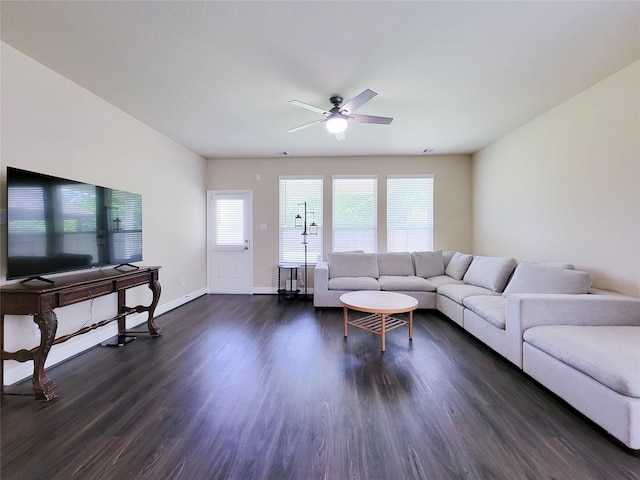 3430 Hughes Meadow Way, Richmond, TX 77406 - living room featuring ceiling fan, dark wood-type flooring, and baseboards