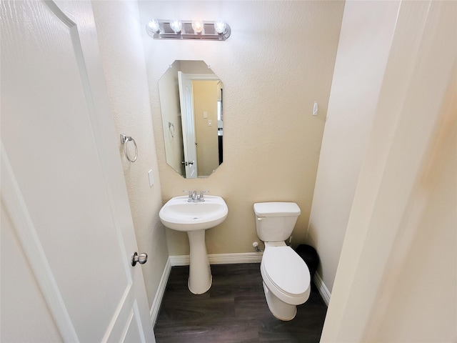 3430 Hughes Meadow Way, Richmond, TX 77406 - bathroom with toilet, wood finished floors, baseboards, and a chandelier