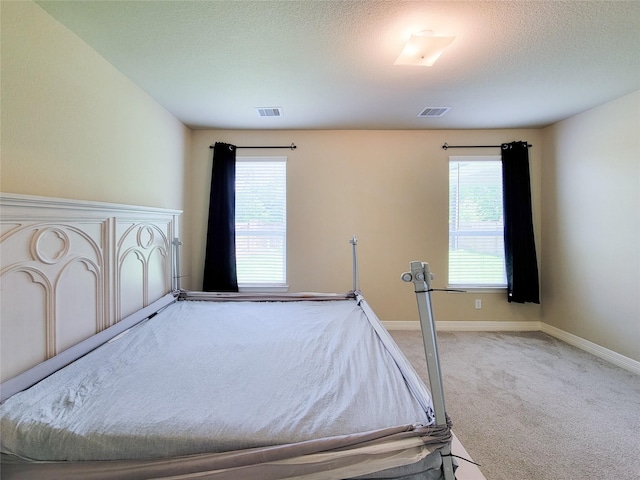 3430 Hughes Meadow Way, Richmond, TX 77406 - carpeted bedroom with baseboards and a textured ceiling