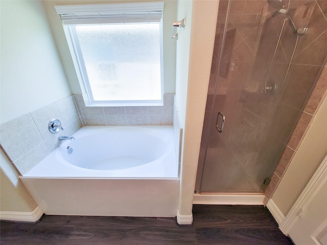 3430 Hughes Meadow Way, Richmond, TX 77406 - full bathroom featuring wood finished floors, a shower stall, healthy amount of natural light, and a garden tub