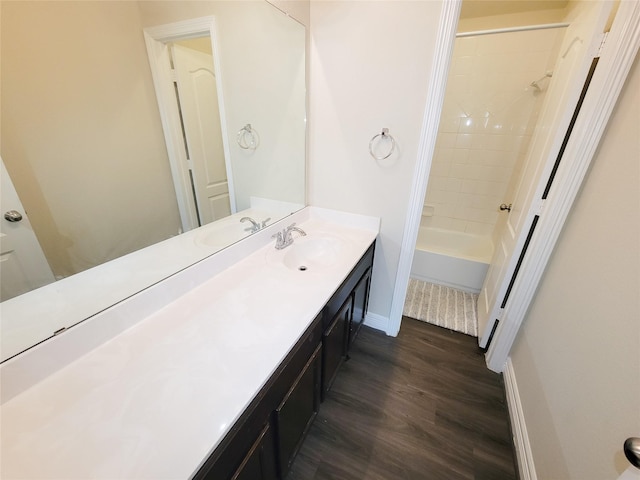 3430 Hughes Meadow Way, Richmond, TX 77406 - full bathroom featuring wood finished floors, vanity, baseboards, and shower / tub combination